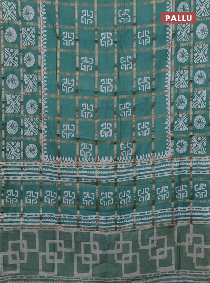 Semi chanderi saree green with allover zari checks & batik prints in borderless style