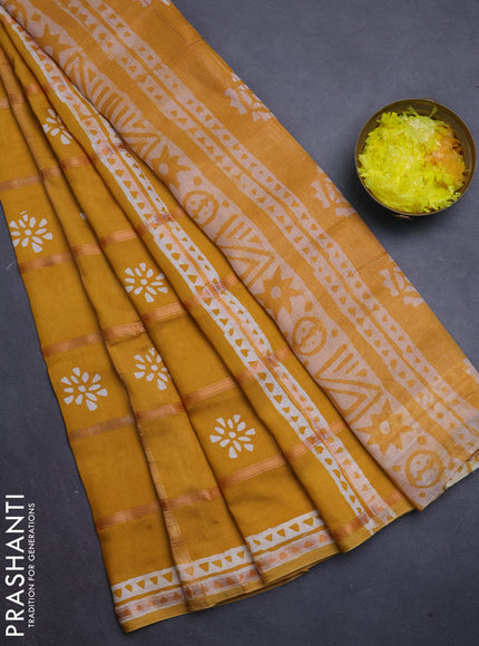 Semi chanderi saree mustard yellow with allover zari checks & batik prints in borderless style