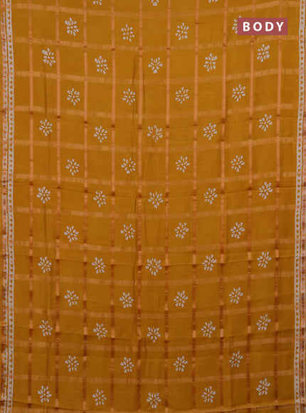 Semi chanderi saree mustard yellow with allover zari checks & batik prints in borderless style