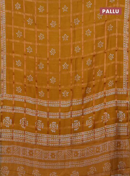 Semi chanderi saree mustard yellow with allover zari checks & batik prints in borderless style