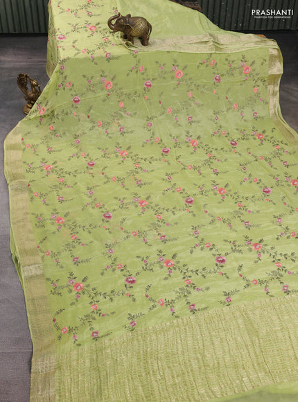 Chiffon saree pista green with allover floral embroidery work and zari woven border