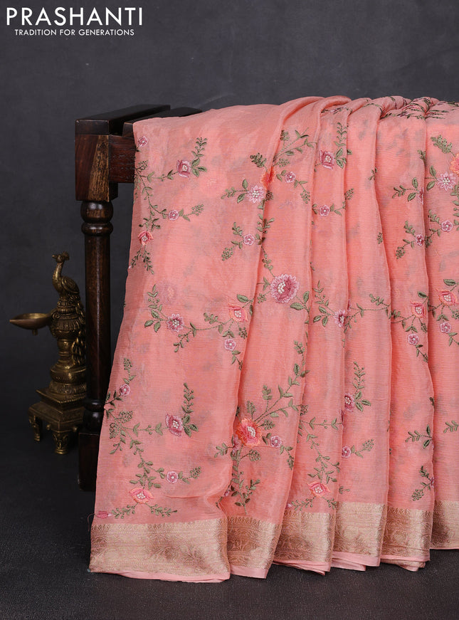 Chiffon saree peach shade with allover floral embroidery work and zari woven border