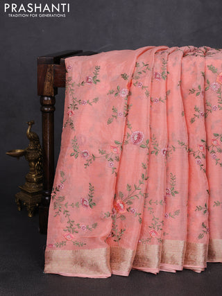 Chiffon saree peach shade with allover floral embroidery work and zari woven border