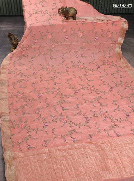 Chiffon saree peach shade with allover floral embroidery work and zari woven border