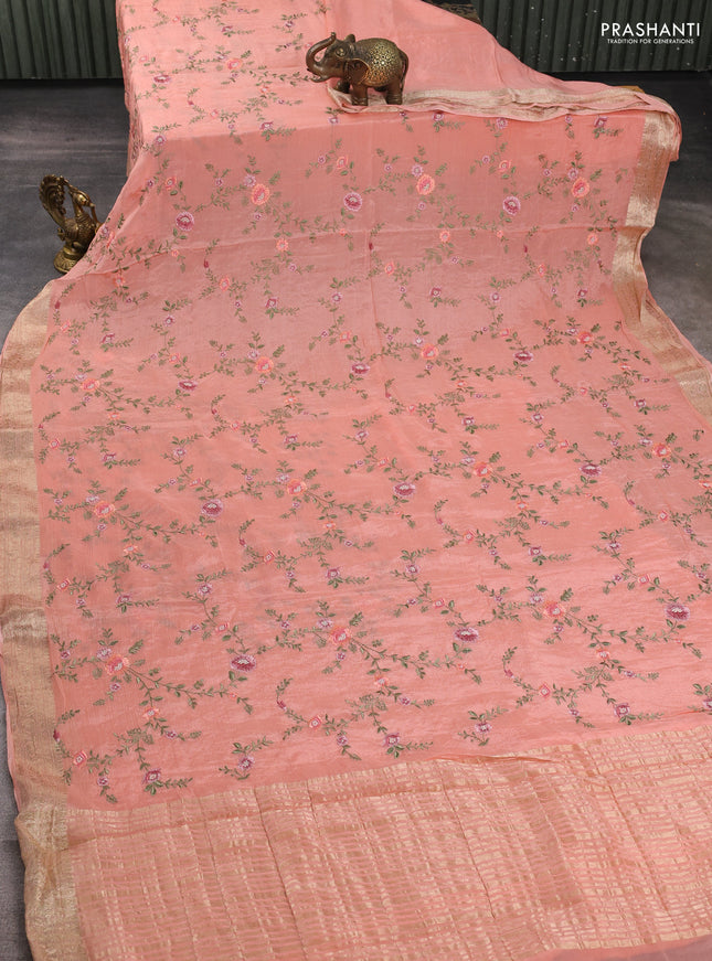 Chiffon saree peach shade with allover floral embroidery work and zari woven border