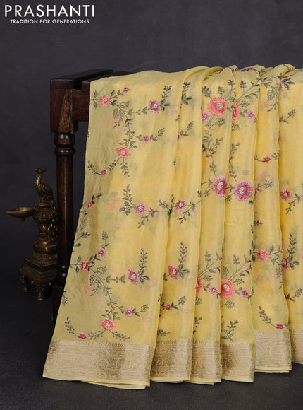 Chiffon saree yellow with allover floral embroidery work and zari woven border