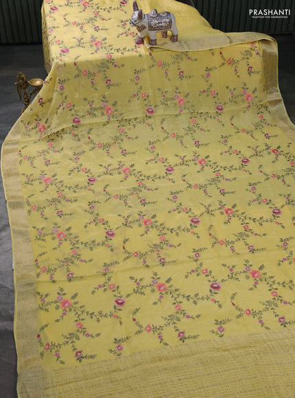 Chiffon saree yellow with allover floral embroidery work and zari woven border