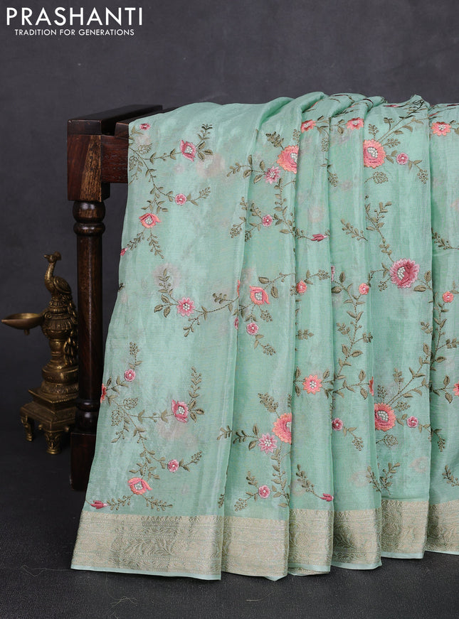 Chiffon saree pastel green with allover floral embroidery work and zari woven border