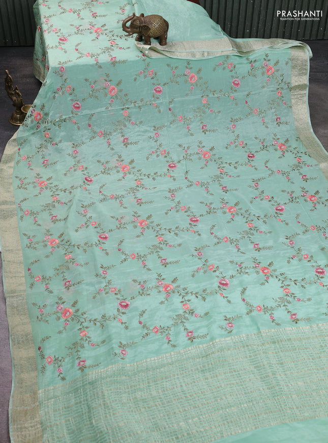 Chiffon saree pastel green with allover floral embroidery work and zari woven border