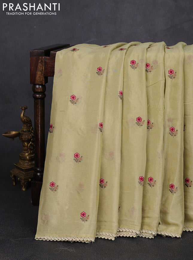 Chiffon saree mild pista green with allover floral embroidery buttas and lace work border
