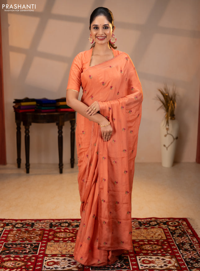 Chiffon saree peach shade with allover floral embroidery buttas and lace work border