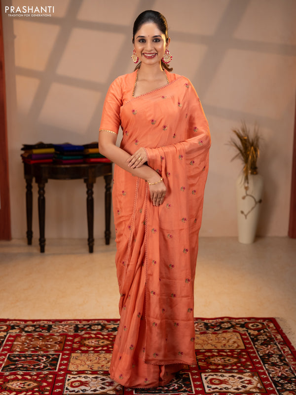 Chiffon saree peach shade with allover floral embroidery buttas and lace work border