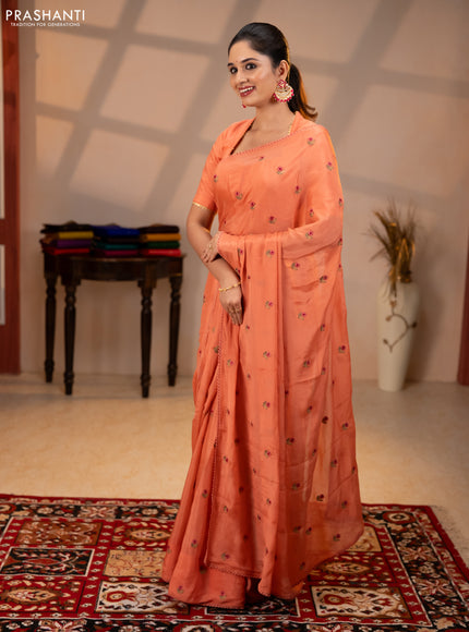 Chiffon saree peach shade with allover floral embroidery buttas and lace work border