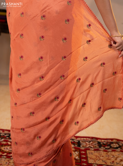 Chiffon saree peach shade with allover floral embroidery buttas and lace work border