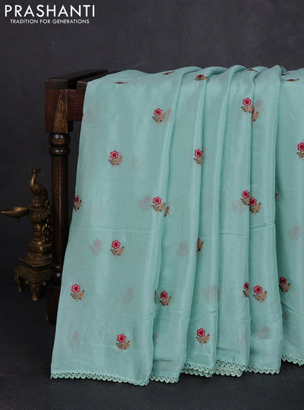 Chiffon saree teal shade with allover floral embroidery buttas and lace work border