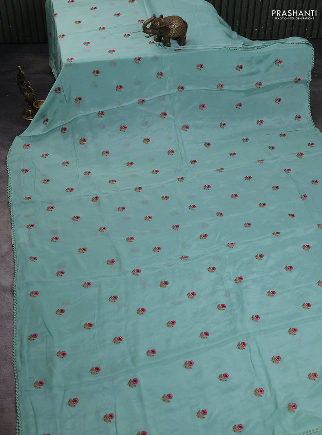 Chiffon saree teal shade with allover floral embroidery buttas and lace work border