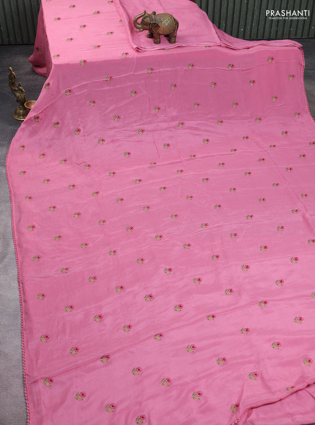 Chiffon saree pink shade with allover floral embroidery buttas and lace work border