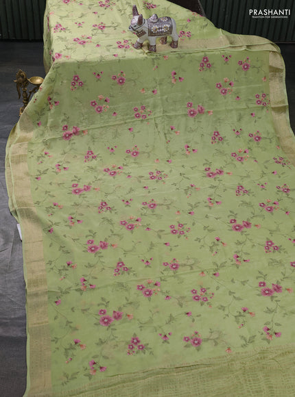Chiffon saree pista green with allover floral embroidery work and zari woven border