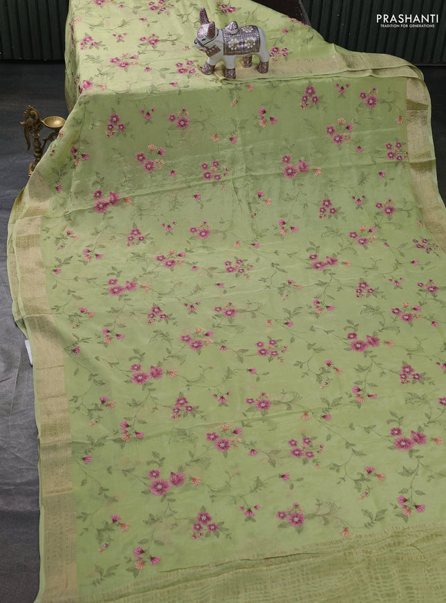 Chiffon saree pista green with allover floral embroidery work and zari woven border