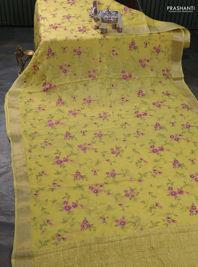 Chiffon saree pale yellow with allover floral embroidery work and zari woven border