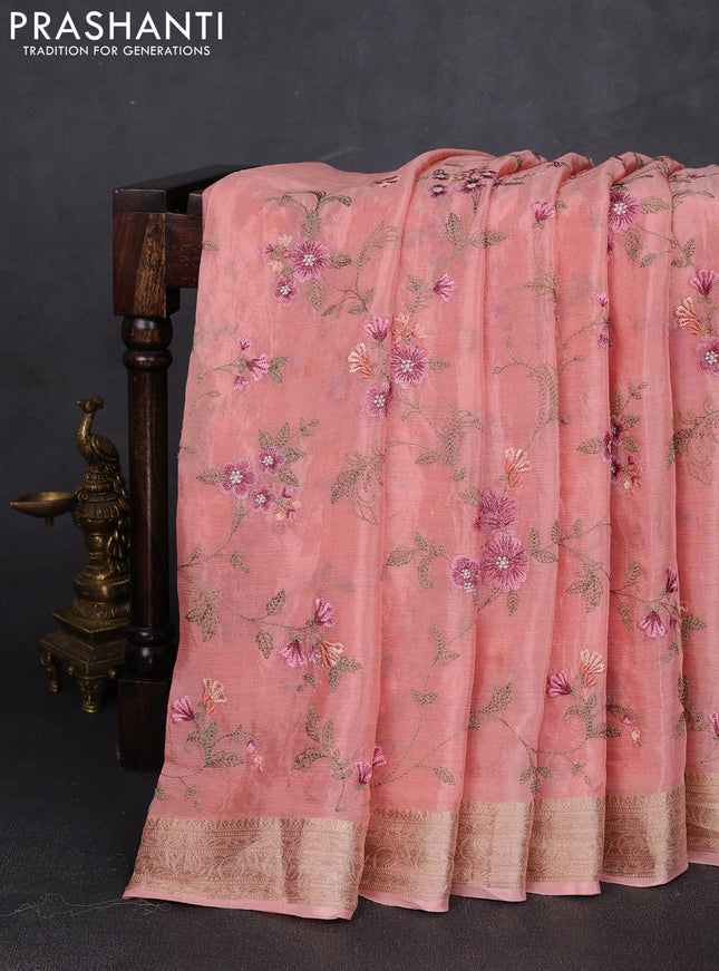 Chiffon saree peach shade with allover floral embroidery work and zari woven border