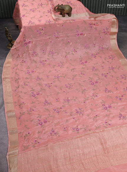 Chiffon saree peach shade with allover floral embroidery work and zari woven border