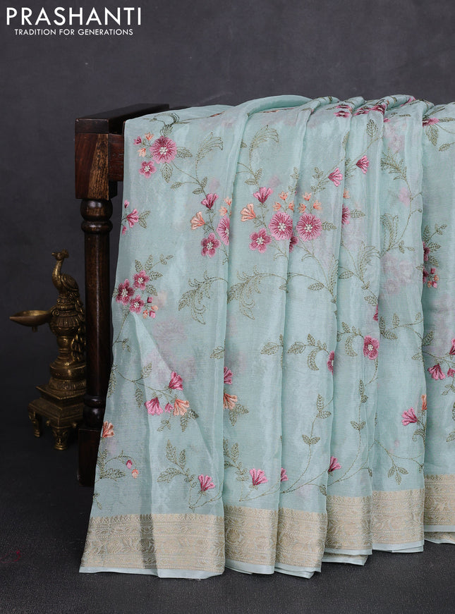 Chiffon saree teal shade with allover floral embroidery work and zari woven border