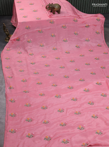 Chiffon saree peach pink with allover floral embroidery work and zari woven border