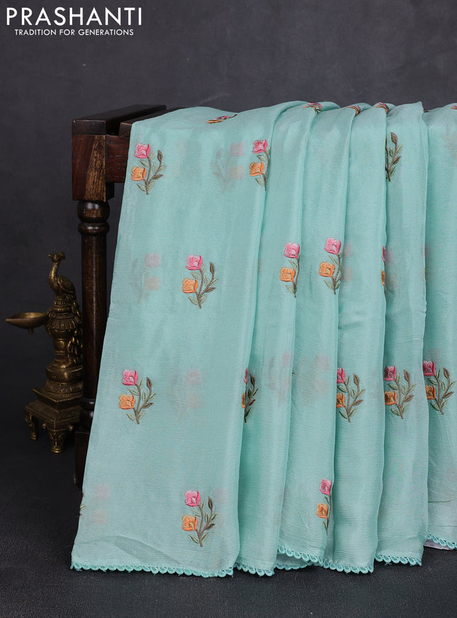 Chiffon saree teal shade with allover floral embroidery work and zari woven border