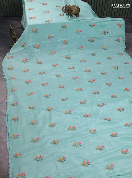 Chiffon saree teal shade with allover floral embroidery work and zari woven border