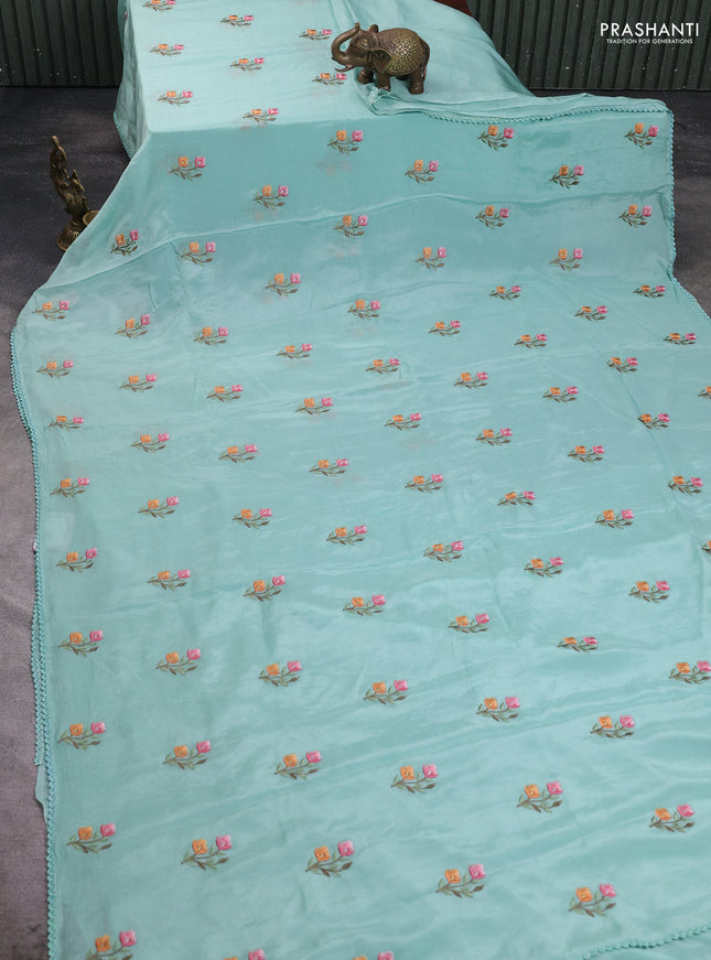 Chiffon saree teal shade with allover floral embroidery work and zari woven border