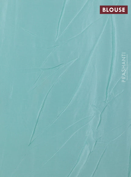Chiffon saree teal shade with allover floral embroidery work and zari woven border