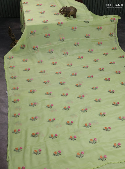 Chiffon saree pista green with allover floral embroidery work and zari woven border