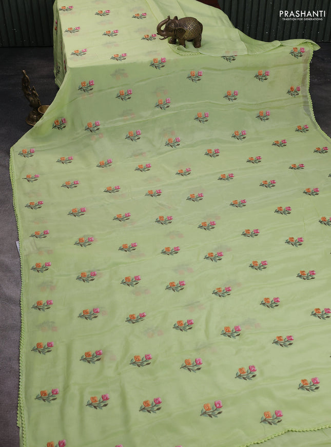 Chiffon saree pista green with allover floral embroidery work and zari woven border