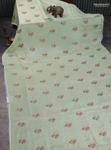 Chiffon saree pista green with allover floral embroidery work and zari woven border