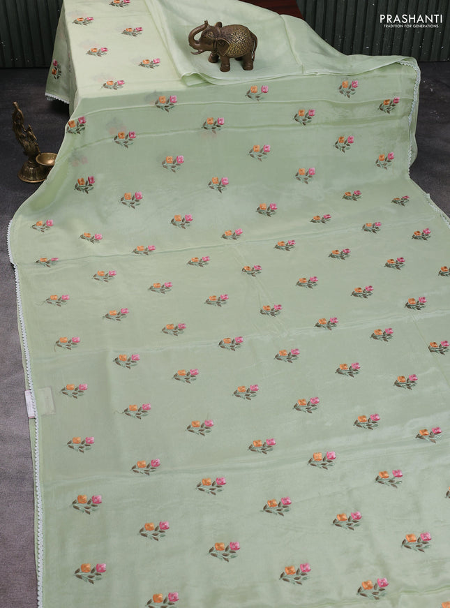 Chiffon saree pista green with allover floral embroidery work and zari woven border