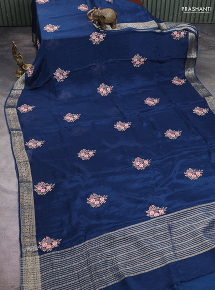 Chiffon saree peacock blue with floral embroidery work and zari woven border
