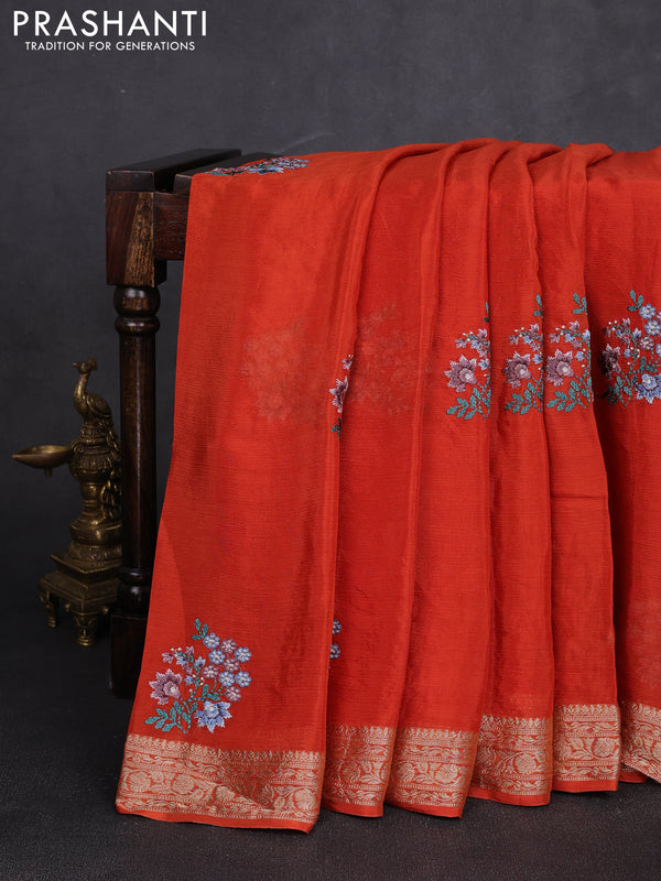 Chiffon saree rustic orange with floral embroidery work and zari woven border