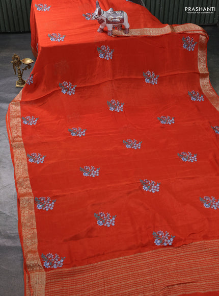 Chiffon saree rustic orange with floral embroidery work and zari woven border