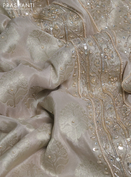 Banarasi silk saree beige shade with allover zari woven buttas and zardosi work pallu & border