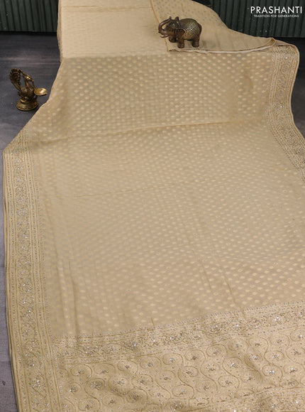 Banarasi silk saree beige with allover zari woven buttas and zardosi work pallu & border