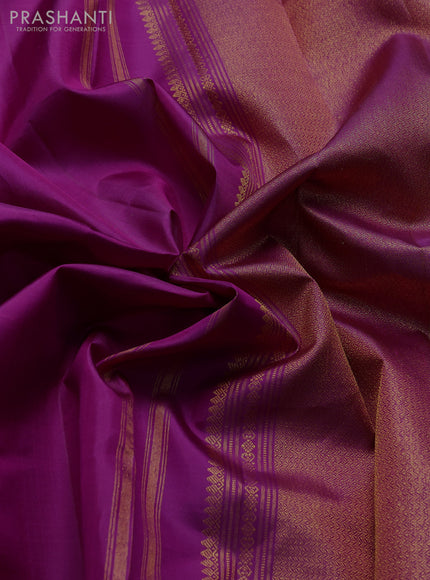 Pure kanchipuram silk saree purple with plain body and zari woven parrot butta border