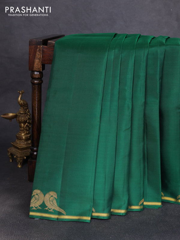 Pure kanchipuram silk saree green with plain body and zari woven parrot butta border