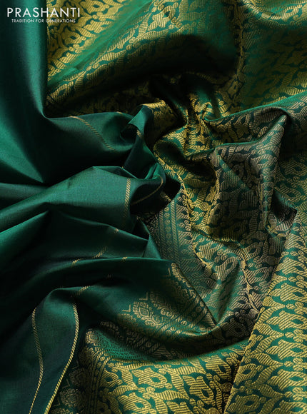 Pure kanchipuram silk saree green with plain body and zari woven parrot butta border