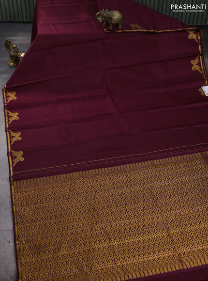 Pure kanchipuram silk saree wine shade with plain body and zari woven parrot butta border
