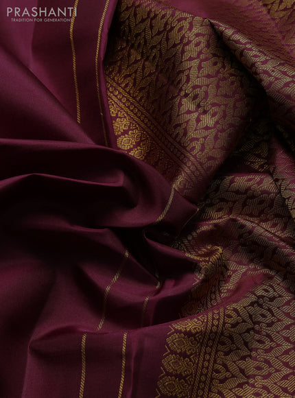 Pure kanchipuram silk saree wine shade with plain body and zari woven parrot butta border