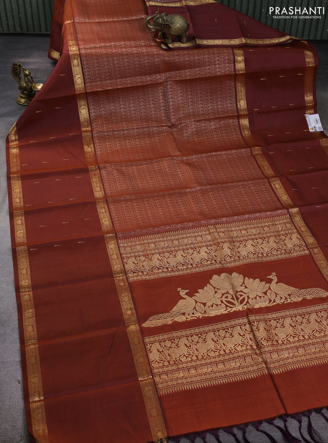 Pure kanchipuram silk saree rust shade with allover thread woven brocade weaves and long zari woven muniya butta border