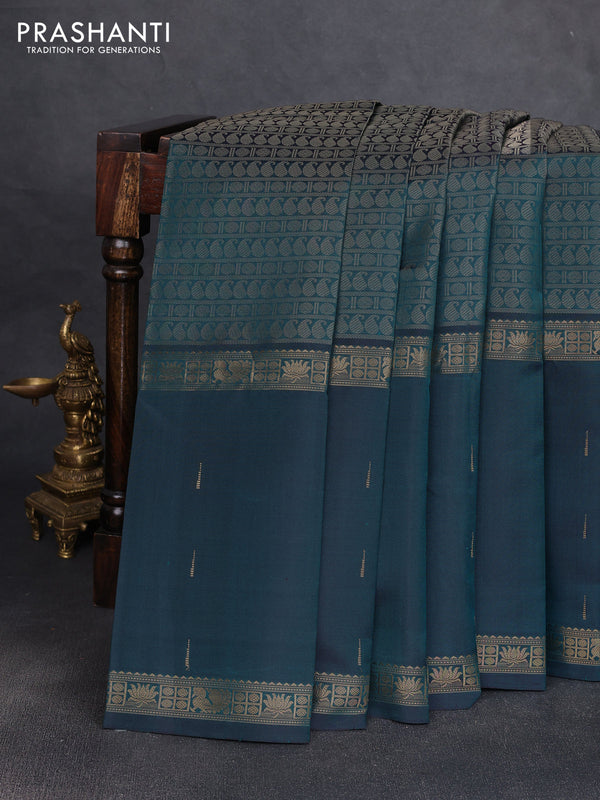 Pure kanchipuram silk saree peacock green with allover thread woven brocade weaves and long zari woven muniya butta border