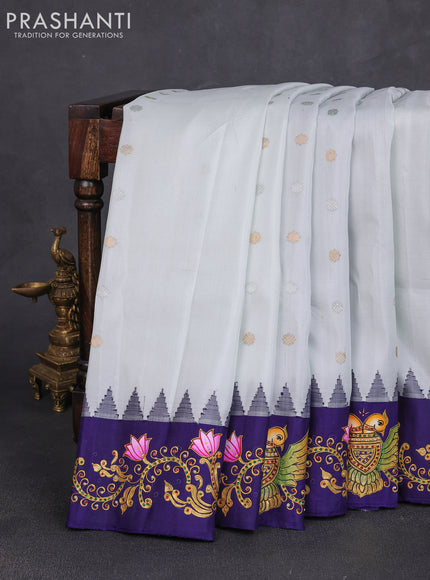 Pure gadwal silk saree off white and blue with zari woven buttas and temple design tanjore painted border