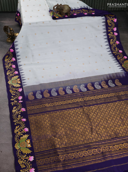 Pure gadwal silk saree off white and blue with zari woven buttas and temple design tanjore painted border